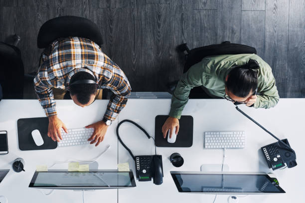 High angle shot of a group of call centre agents working in an office